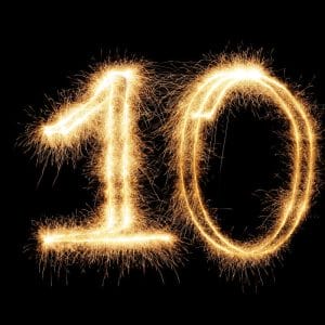Sparkling number 10 formed from fireworks sparklers, marking ten years