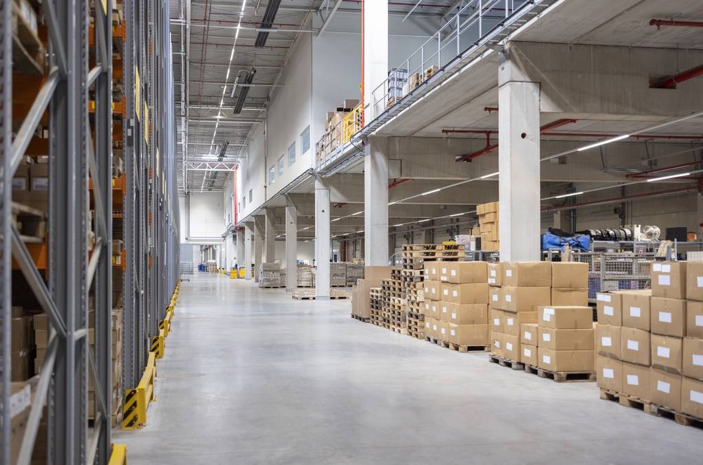 Distribution warehouse with stacked boxes on storage racks