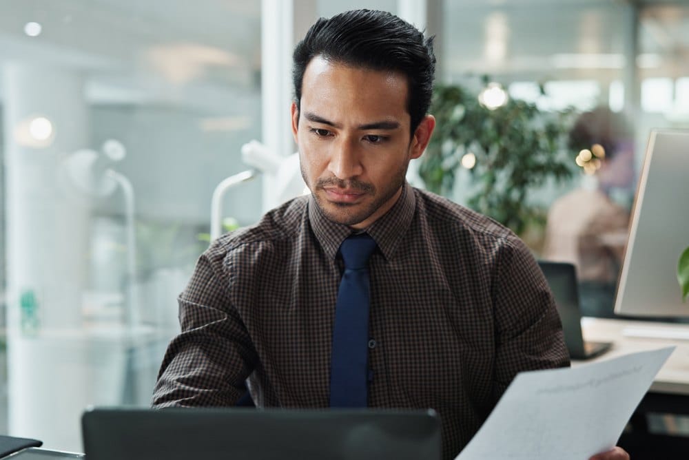 Reviewing order documentation on a laptop