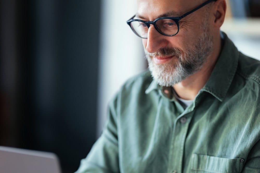 Buyer reviewing options on a laptop in an office