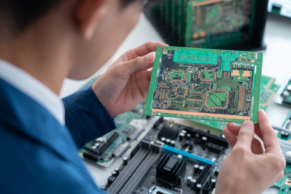 Engineer researching semiconductors at a workbench