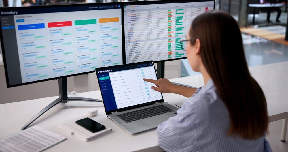 Sourcing specialist scanning supplier data across multiple screens
