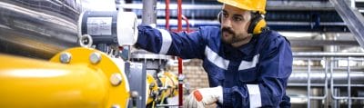 Refinery worker checking an LPG pipeline
